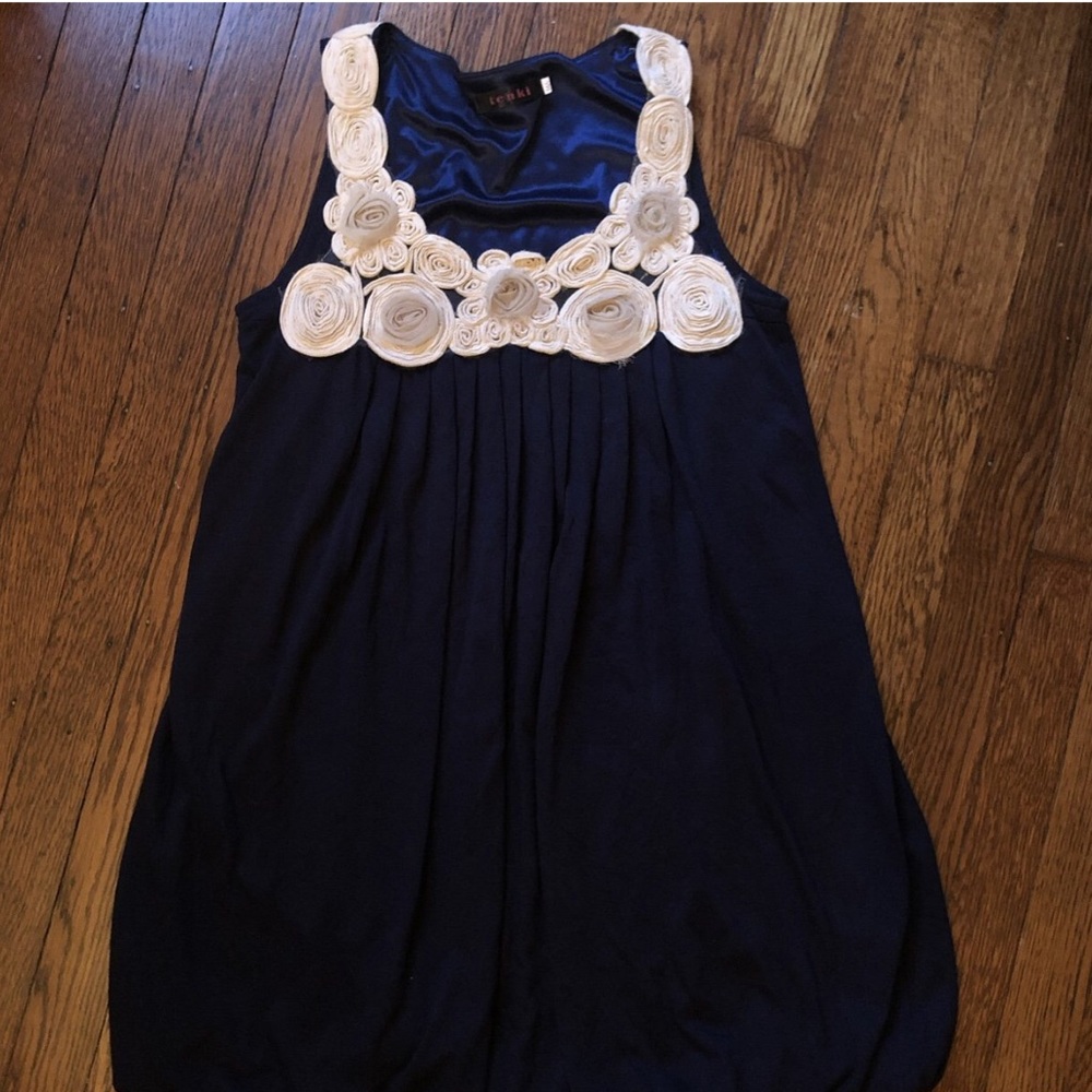Navy dress with creme colored roses on the collar